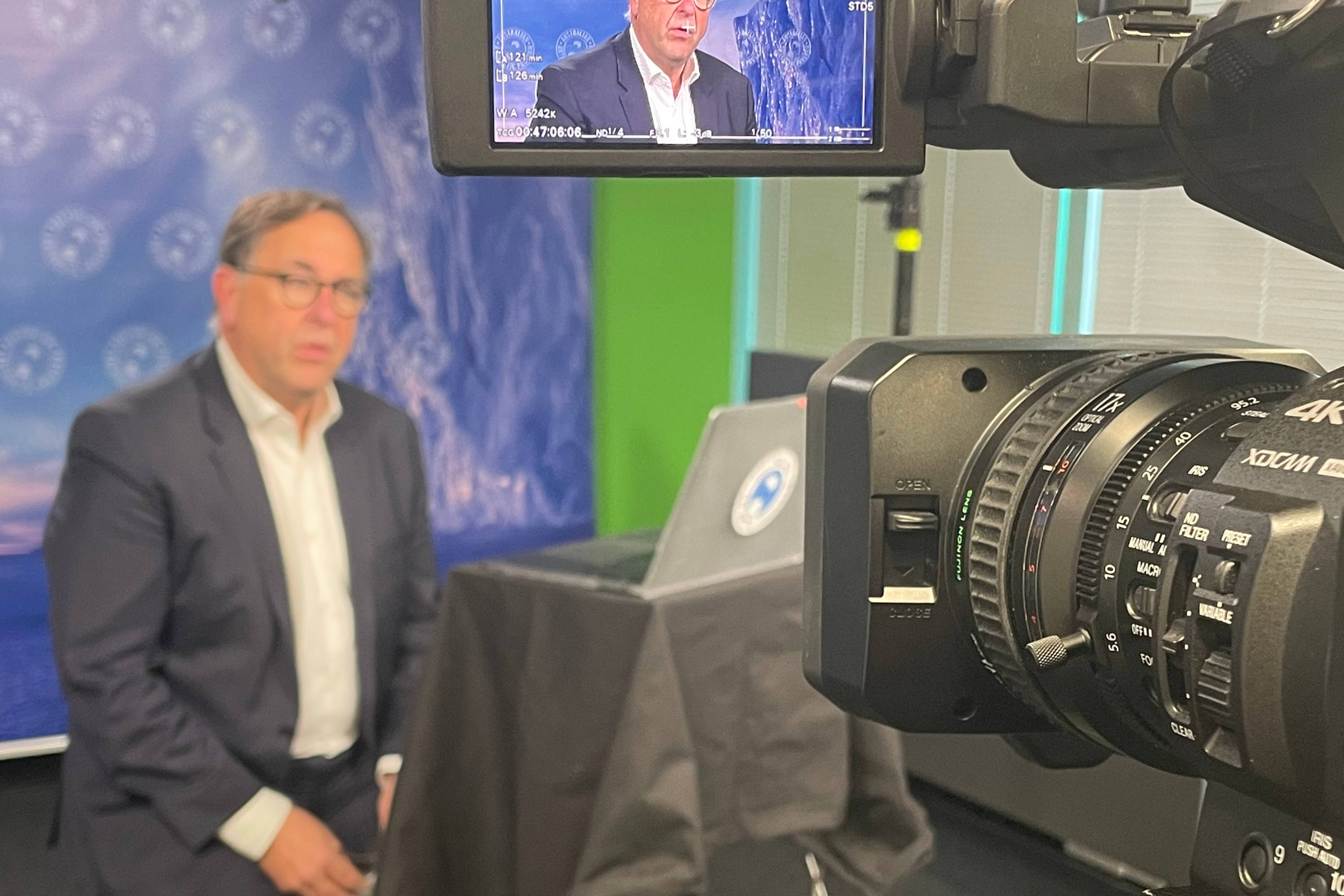 CARMM Chair, Dr Jeff Ayton, in front of a video camera with image on view finder. Photo: Nisha Harris.
