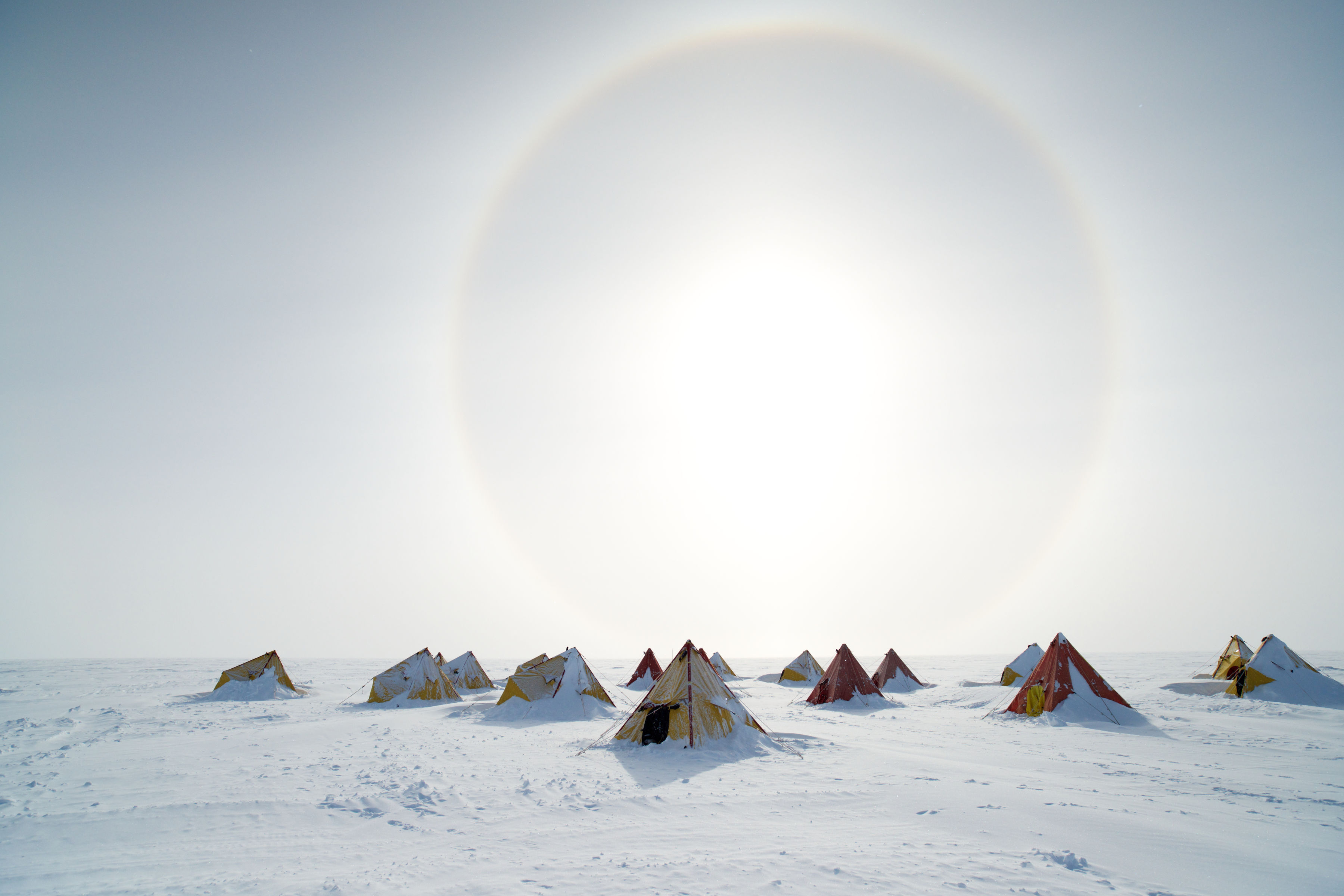Pyramid tents are dwarfed under the stunning solar halo. Photo: Anthony (Tony) Fleming.