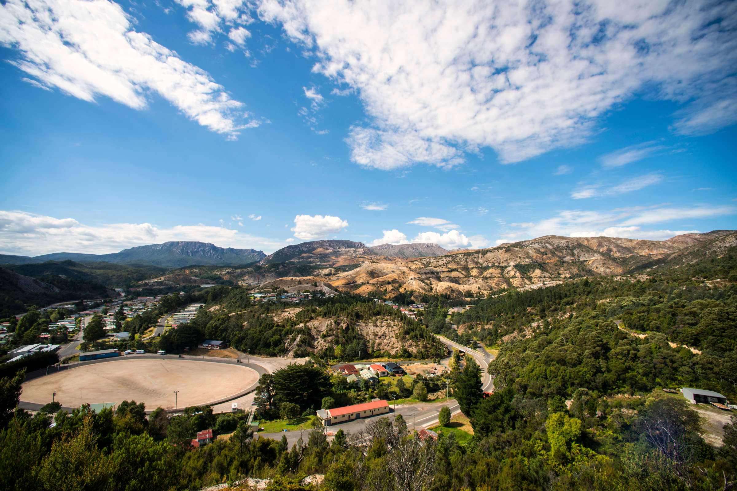 View from hills above small former mining town. Photo: Rob Burnett / Tourism Tasmania.
