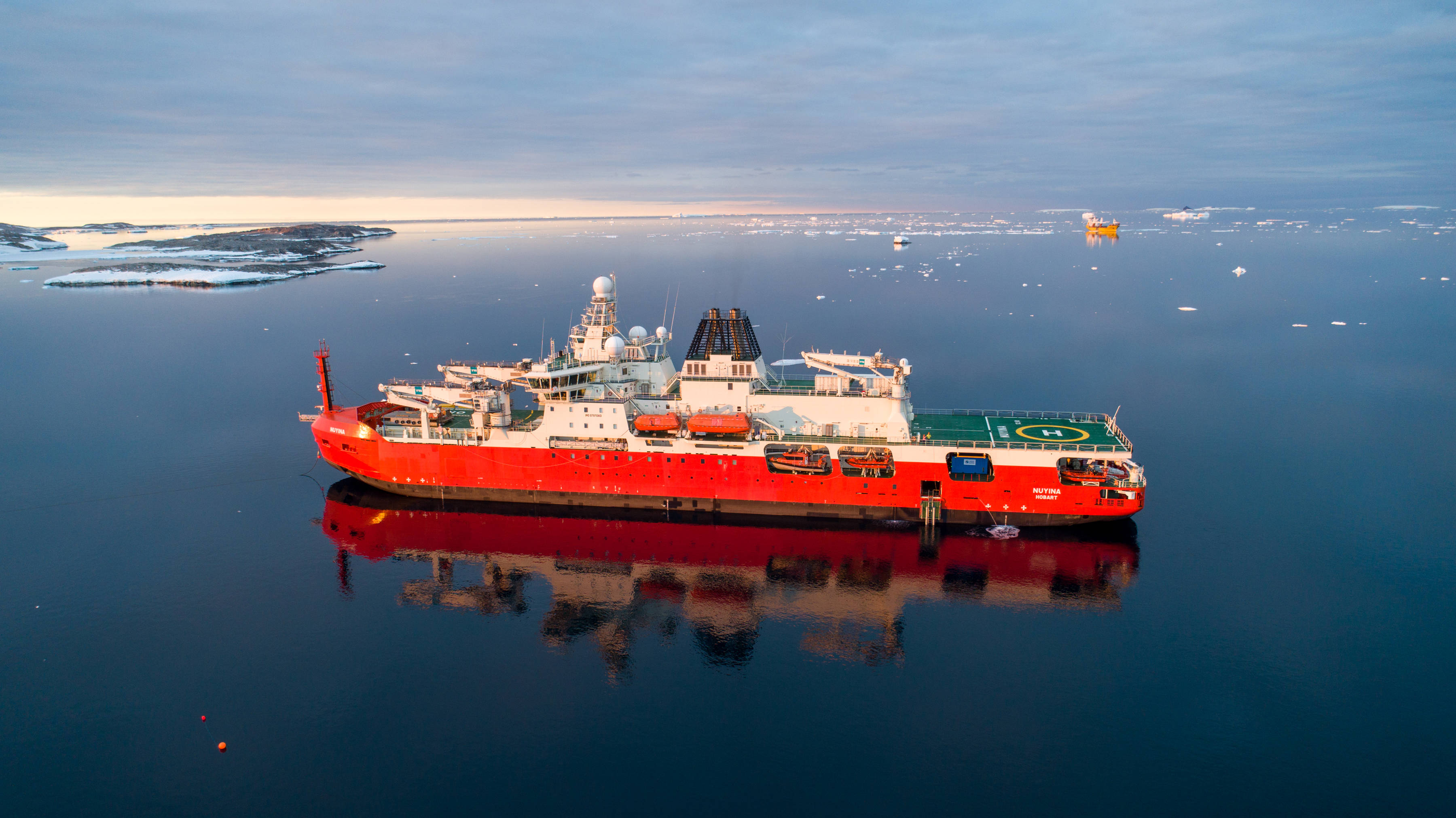 RSV Nuyina and Happy Dragon at Australia’s Casey research station. Photo: Pete Harmsen.