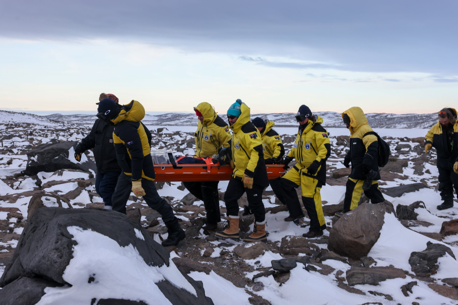 Two medical practitioners responsing to mock emergency with dummy patient on a stretcher. Photo: Grant Jasiunas.